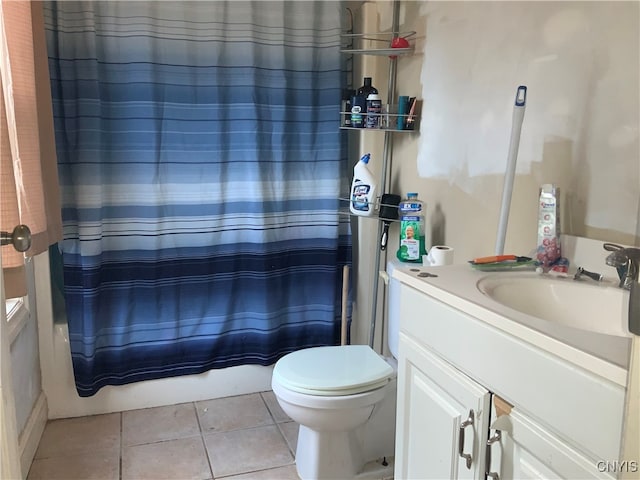 full bathroom featuring tile patterned flooring, toilet, vanity, and shower / tub combo