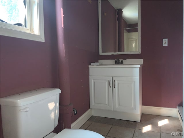 bathroom featuring tile patterned floors, vanity, and toilet