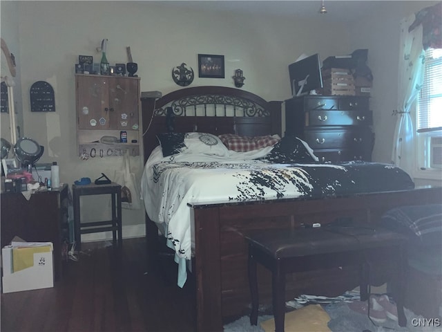 bedroom with hardwood / wood-style flooring