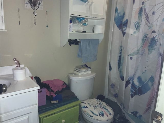 bathroom featuring vanity and toilet