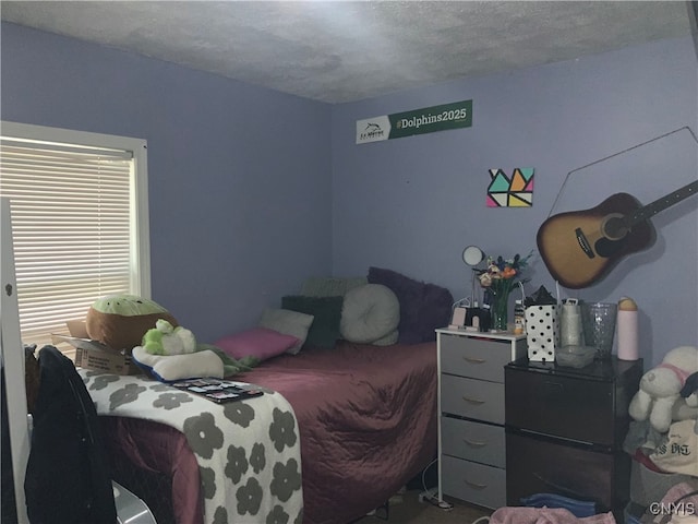 bedroom featuring a textured ceiling