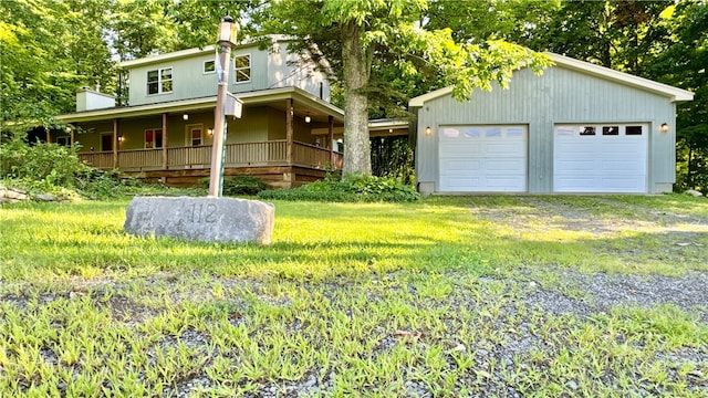 exterior space with a garage and a front lawn