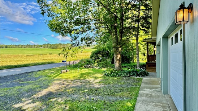 view of yard featuring a garage