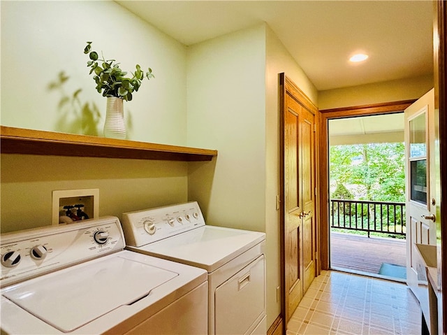 clothes washing area featuring washing machine and clothes dryer