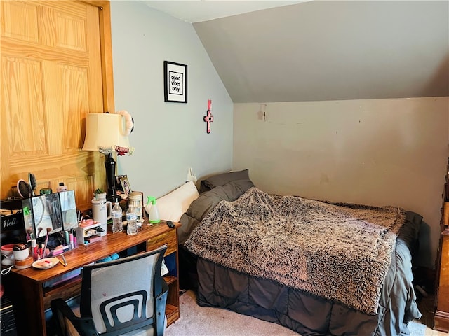 bedroom featuring vaulted ceiling and carpet floors