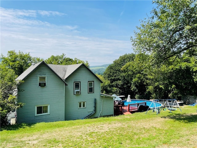 view of side of home featuring a yard