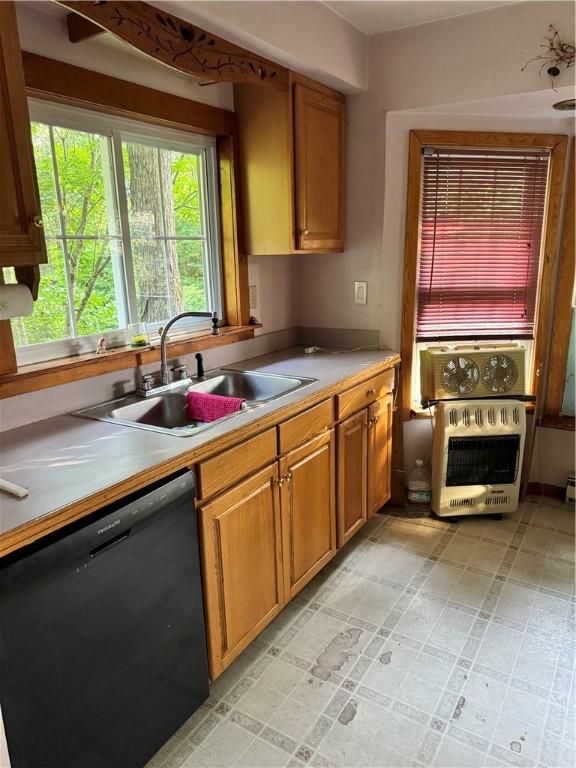 1356 Terry Clove Rd, Hamden, NY 13752 - kitchen featuring dishwasher, a sink, heating unit, and brown cabinetry