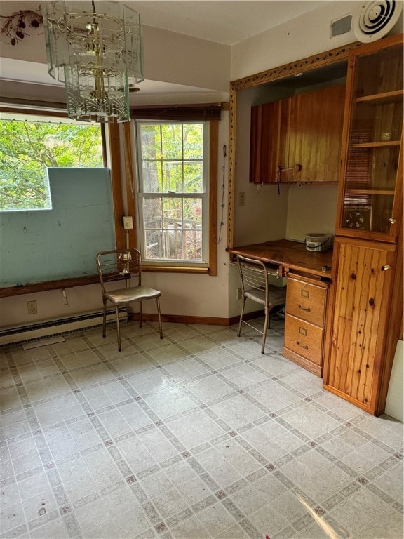 unfurnished office featuring light tile patterned flooring and a baseboard heating unit