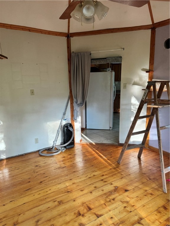 spare room with light hardwood / wood-style flooring and ceiling fan