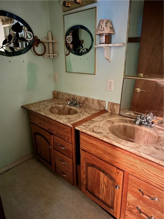 bathroom with tile patterned flooring and vanity