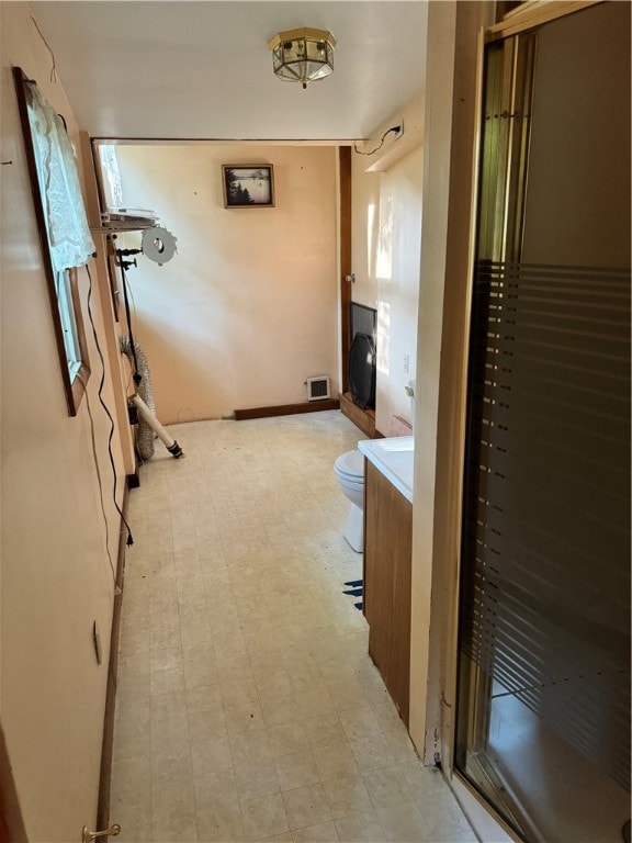 corridor featuring light tile patterned floors