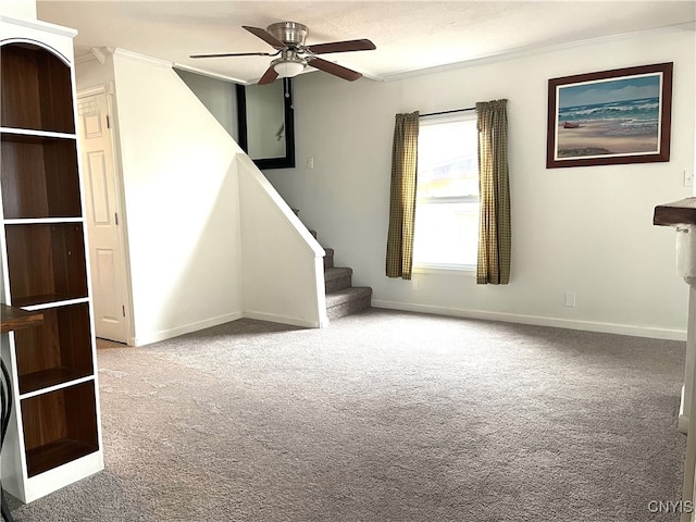 unfurnished living room with light carpet, ceiling fan, and ornamental molding