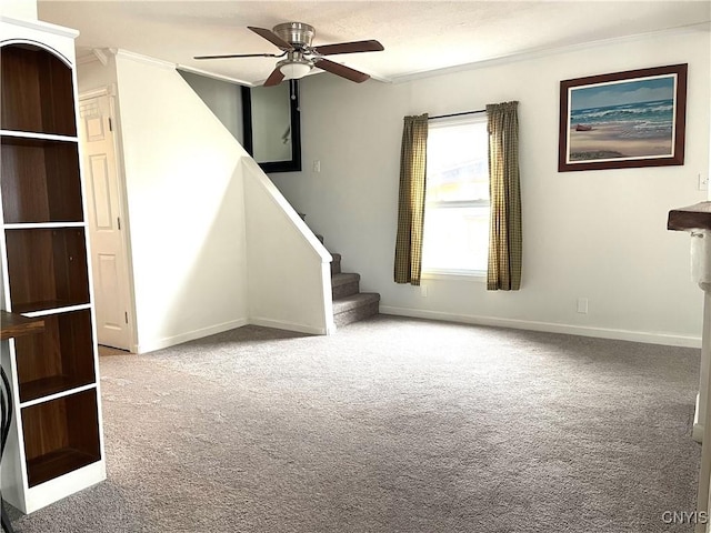 132 E Remington St, Rutland, NY 13612 - carpeted empty room with ornamental molding, ceiling fan, baseboards, and stairway