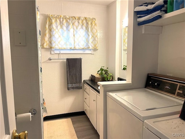 132 E Remington St, Rutland, NY 13612 - laundry room featuring separate washer and dryer, dark wood finished floors, and tile walls