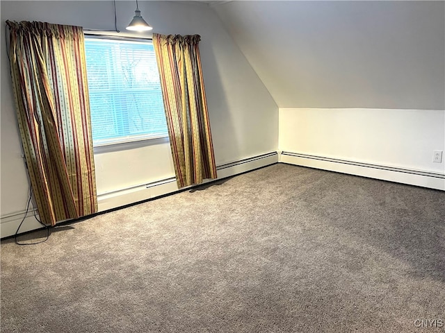 additional living space with carpet flooring and lofted ceiling