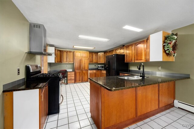 kitchen featuring black fridge, light tile patterned floors, sink, kitchen peninsula, and range with gas stovetop