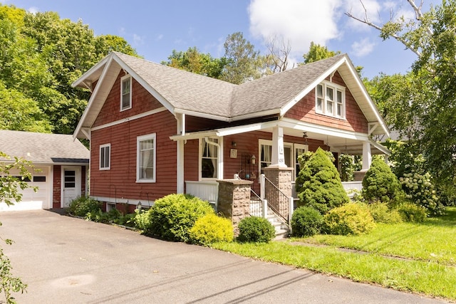 craftsman-style home featuring a garage and covered porch