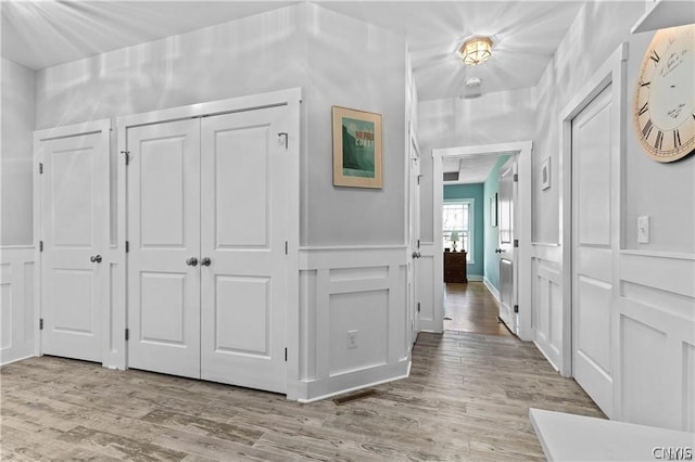 corridor featuring light hardwood / wood-style flooring