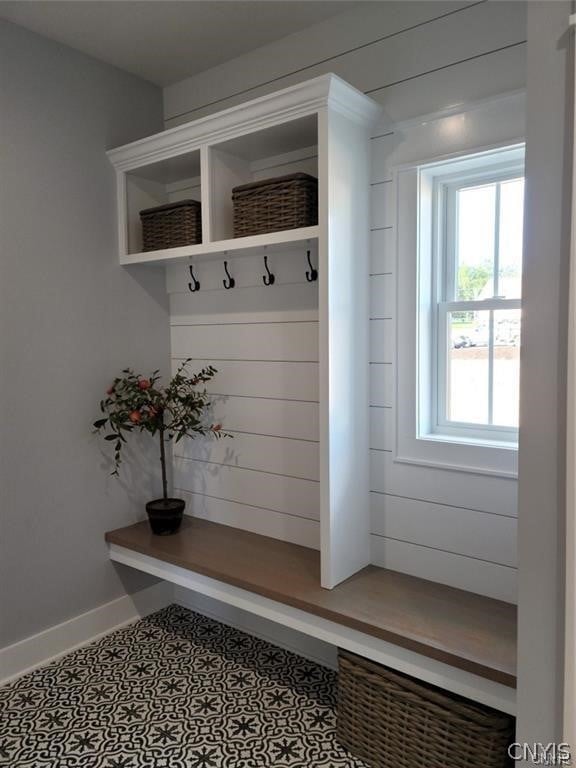 mudroom with tile patterned floors