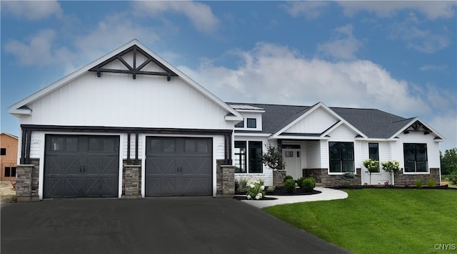 view of front of house featuring a garage and a front lawn