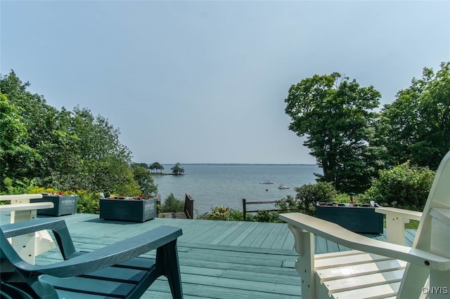 wooden deck with a water view