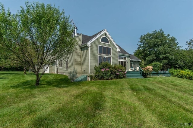 27454 County Route 57, Lyme, NY 13693 - view of home's exterior with a chimney and a yard