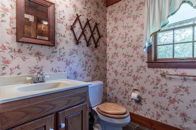 27454 County Route 57, Lyme, NY 13693 - half bath featuring wallpapered walls, toilet, vanity, and baseboards