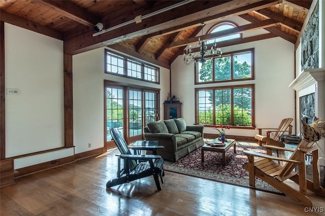 27454 County Route 57, Lyme, NY 13693 - living room featuring wooden ceiling with exposed beams, a fireplace, plenty of natural light, wood-type flooring, and high vaulted ceiling