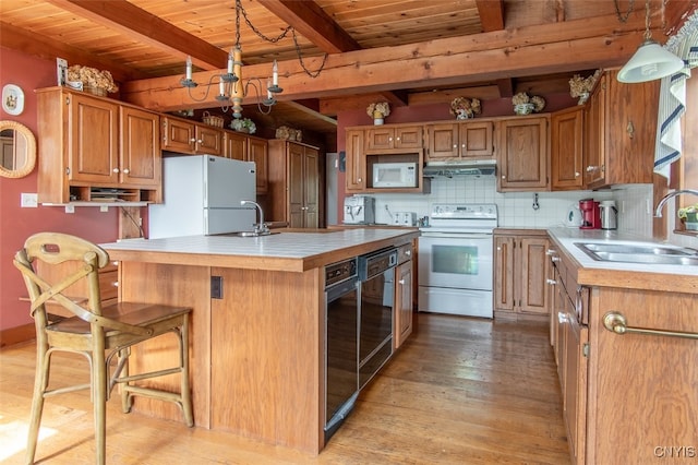 kitchen featuring light hardwood / wood-style flooring, wood ceiling, beam ceiling, sink, and white appliances