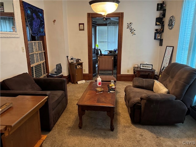 carpeted living room featuring a healthy amount of sunlight and ceiling fan