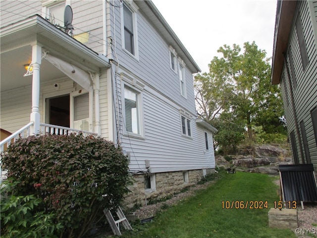 view of property exterior featuring a yard