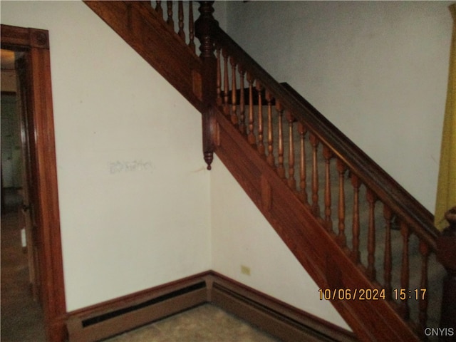 stairs featuring a baseboard radiator