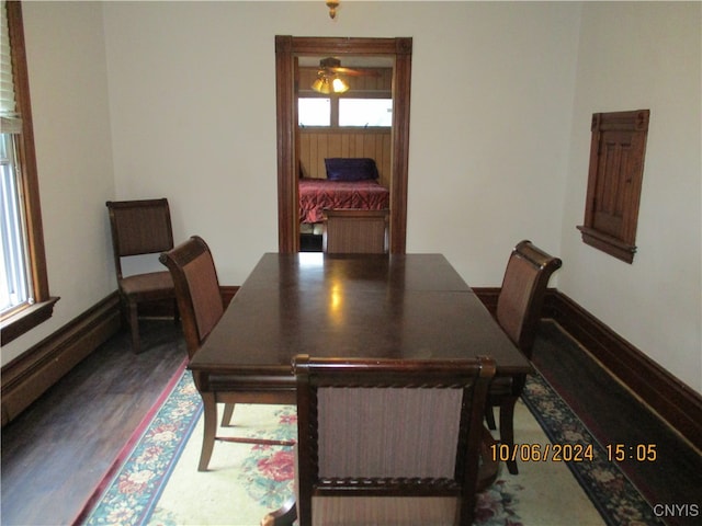 dining area with wood-type flooring and ceiling fan