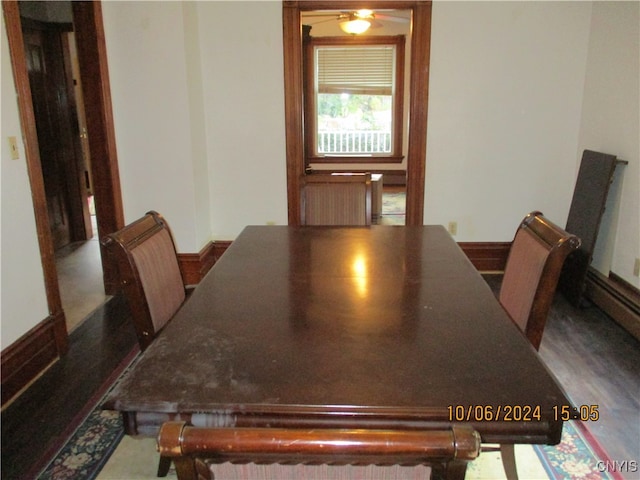 unfurnished dining area with wood-type flooring and ceiling fan