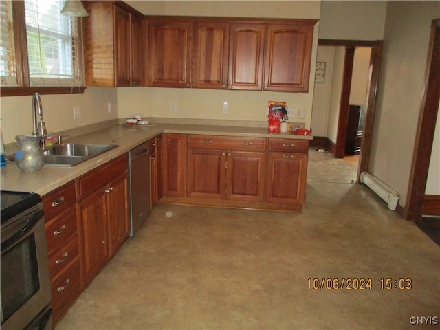 kitchen with sink, baseboard heating, and stainless steel appliances