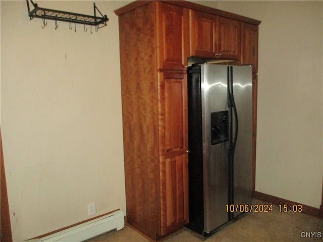 kitchen with a baseboard heating unit, stainless steel fridge with ice dispenser, and light colored carpet