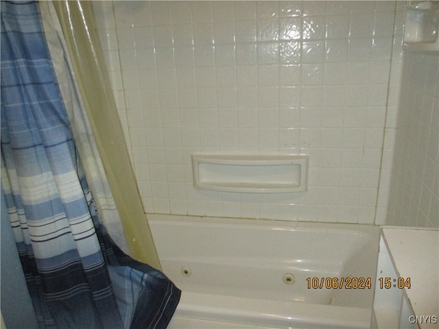 bathroom with shower / bath combination with curtain