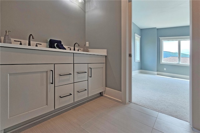 bathroom with vanity and tile patterned floors