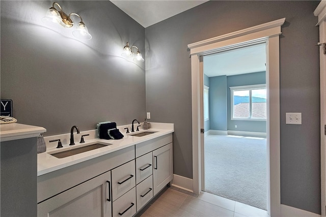 bathroom featuring tile patterned flooring and vanity