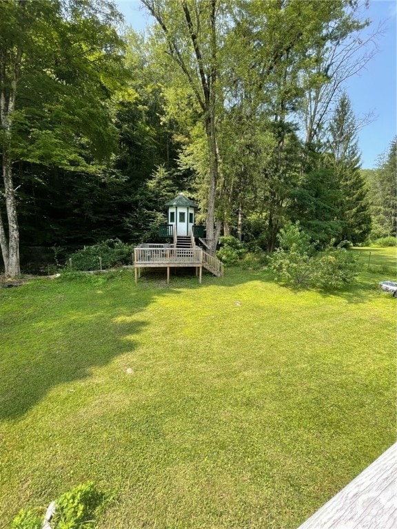 view of yard featuring a wooden deck