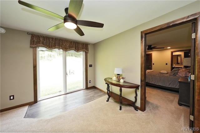 carpeted bedroom featuring ceiling fan and access to exterior