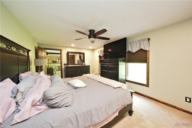 bedroom featuring ceiling fan and light colored carpet