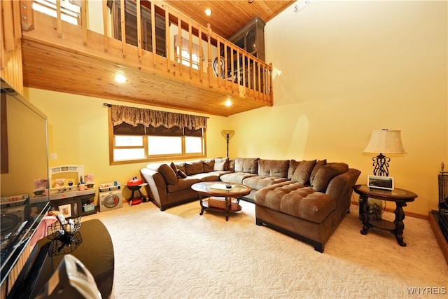 living room featuring wooden ceiling, carpet, and a high ceiling