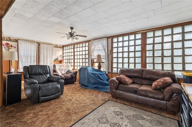 carpeted living room featuring ceiling fan