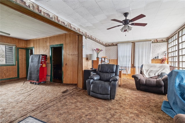 1793 County Highway 9, Davenport, NY 12197 - carpeted living area with ceiling fan, wallpapered walls, and wood walls