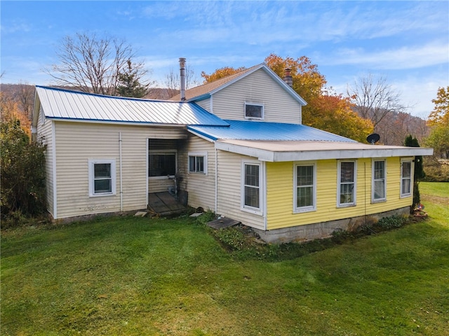 1793 County Highway 9, Davenport, NY 12197 - back of property with a lawn, a metal roof, and a chimney
