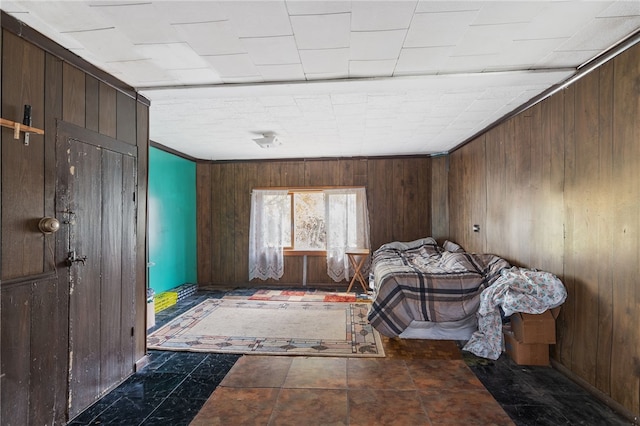 unfurnished bedroom with wood walls