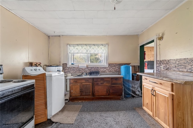 laundry room with washer / dryer and dark carpet