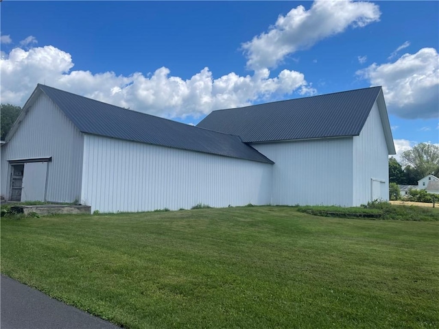 view of property exterior with a lawn