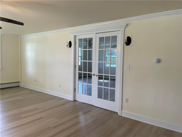 unfurnished room with light hardwood / wood-style flooring, ornamental molding, french doors, and baseboard heating